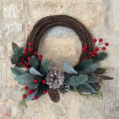 An elegant combination of winter foliage, sprigs of fir, pinecones and glossy red berries in the lower half of this festive wreath is perfectly complemented by the simplicity of the natural rattan base on the top half. The half-wreath is a contemporary look which has been trending recently and it's also ideal if you want to add some Christmas cheer to your entrance when your door won't comfortably take a full circle.  Also available as a Rattan Star. Rattan Christmas Wreath, Christmas Wreaths Homemade, Half Wreath Christmas, Rattan Wreath Ideas, Rattan Wreath, Homemade Christmas Wreaths, Half Wreath, Winter Foliage, Christmas Door Wreath