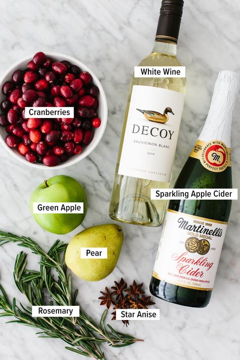 This white Christmas sangria sparkles with seasonal colors, is splashed with apple cider, and turns white wine into the best holiday drink! White Christmas Sangria, Holiday Sangria, Christmas Sangria, Holiday Beverages, Sparkling Cider, Holiday Drink, Mixed Drinks Recipes, Christmas Brunch, Total Wine