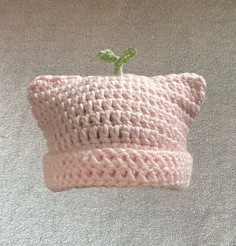 The Pink Sprout Plant Cat Beanie is meant for those who want to add something unique yet adorable to your wardrobe but also convenient for the fast approaching colder months. The plant is made of a cotton and acrylic blend of yarn (60% cotton, 40% acrylic) and the pink beanie part is made up of alpaca and acrylic blend yarn (80% acrylic, 20% alpaca wool), handmade crotched by me. PLEASE READ IN REGARDS TO MATERIALS: Because the pink base of the beanie is made of alpaca wool, there are hairs that