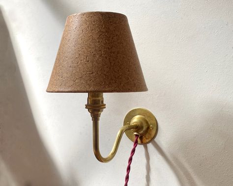 INTRODUCING: The Matilda Plug-in Sconce ✨ I am so proud to introduce this new plug-in wall lamp. Entirely handmade in our Los Angeles studio, we offer this cutie in either polished unlacquered brass or aged brass, and you can pair her with one of our five signature cloth cords colors. Do you like it? (Say yes) Available now ~ link in bio 👩‍💻 #sconce #mattalfordstudio #handmade #shopsmall #brass #antique #lamp #lighting #interiordesign Sconces With Lamp Shades, Shell Cottage, Cabin Bedding, English Country Interiors, Plug In Wall Lamp, Country Interiors, Cottage Lighting, Midcentury Style, Brass Wall Lamp