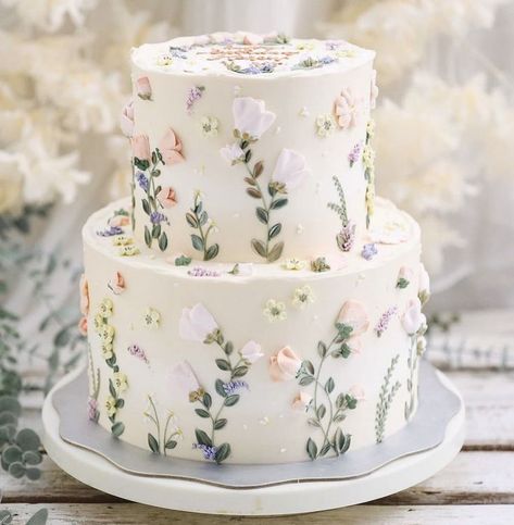 Wedding Cake With Wild Flowers Simple, Simple Cakes Wedding, Mamma Mia Wedding Cake, Floral Wedding Cakes 2 Tier, White Cake With Pastel Flowers, Pastel Bridal Shower Cake, Wedding Cake With Pressed Flowers, Wild Flower Desserts, Bridal Shower Ideas Pastel Colors