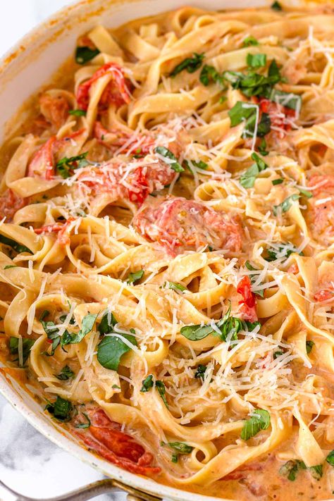 Creamy Tomato Pasta! This fresh creamy tomato pasta is made with fresh cherry tomatoes and basil. It's a fresh take on the classic, but you can make it year-round. Creamy Garlic Tomato Pasta, Pasta With Canned Tomatoes, Creamy Cherry Tomato Pasta, Tomato Sauce Recipe Dishes, Noodles And Tomatoes, Creamy Tomato Basil Pasta, Creamy Tomato Pasta Sauce, Blistered Cherry Tomatoes, Pasta With Cherry Tomatoes