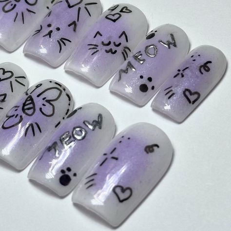 Purple aura with cat doodles😻💜 • • • #nails #nailart #nailsofinstagram #gelnails #beauty #nailsart #nail #nailsdesign #nailartist #naildesigns #nailartist #nailpolish #nailinspo #inspire #gelpolish #pressons #shopify #expolrepage #smallbusiness #custompressons #handpainted #catnails #auranails #doodlenails Cat Theme Nails, Theme Nails, Cat Doodles, Purple Aura, Cat Doodle, Cat Nails, Cat Theme, Cosmetology, Nails Nailart