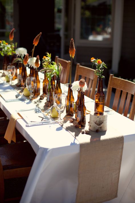 You don't often see brown but these look great! Beer-Bottle-Centerpiece-2 Beer Bottle Centerpieces, Beer Bottle Vase, Fall Wedding Tables, Fall Wedding Ideas, Gray Photography, Bottle Centerpieces, Brewery Wedding, Tafel Decor, Camo Wedding