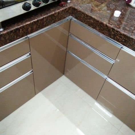 L-Shaped Tan Color Modular Kitchen Laminate Finish #lshapedkitchen #modularkitchen #kitchendesign #laminatefinish #tancolor #andheri Modular Kitchen Laminate Design, Tan Kitchen Cabinets, Kitchen Laminate, L Shaped Modular Kitchen, Modern Tv Unit Designs, Dining Room Cabinet, Modern Tv Units, Laminate Kitchen, Modern Kitchen Cabinet Design