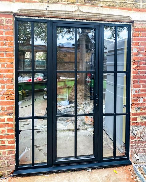 Go for a #crittall #style patio door design to add a bit of modern and industrial feel to your home! This stunning design can be achieved with our slim aluminium SL38 profile that is perfect for replicating #steeldoors look! Pictured here in jet black coatex finish. 😍 Black Crittal Doors External, Aluminium Crittal Style Doors, Black Frame Patio Doors, Crittal Style Porch, Door Aluminium Design, Black Aluminium Doors, Black Patio Doors, Black Aluminium Windows, Barber Decor