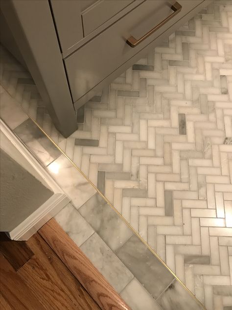 Marble herringbone and inlaid solid brass detail; bathroom tile floor Marble Herringbone Bathroom, Herringbone Bathroom Floor, Herringbone Kitchen Backsplash, Floor Herringbone, Marble Herringbone Floor, Bathroom Tile Floor, Design Interior Baie, Herringbone Tile Floors, Marble Bathroom Floor