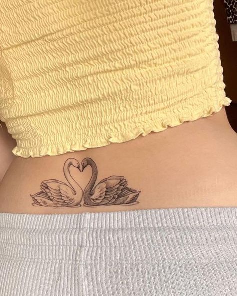 Sultry Tattoo, Symmetrical Lower Back Tattoo, Matching Swan Tattoo, Tattoo For Gf, 2 Swans Tattoo, Tattoo Idea Black Women, Black And White Swan Tattoo, Swan Tramp Stamp, Swan Heart Tattoo