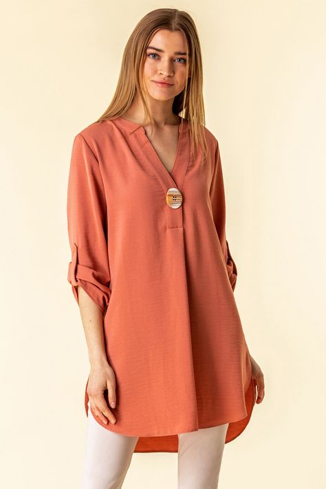 A sure fire way to inject some colour into your looks, this longline tunic top is sure to turn heads. #romanoriginals #roman #springfashion #2021 #springlooks #springtops #everydaytops #longlinetops #tunic #buttontop #salmon Tunics For Women Classy Casual, Tunics For Women Classy, Tunic Tops With Jeans, Long Tunics For Women, Tunic Tops Outfit, Cotton Tunic Tops, Kurta Style, Long Sleeve Tunic Dress, Tunic Designs