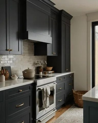 20 Black and Gold Kitchen Ideas That Are Moody, Elegant, and Ready to Recreate Farmhouse Cabinet Colors, Black Shaker Kitchen Cabinets, Ashley Montgomery Design, Black Shaker Kitchen, Ashley Montgomery, Black Shaker Cabinets, Wooden Range, Black And Gold Kitchen, Wooden Range Hood