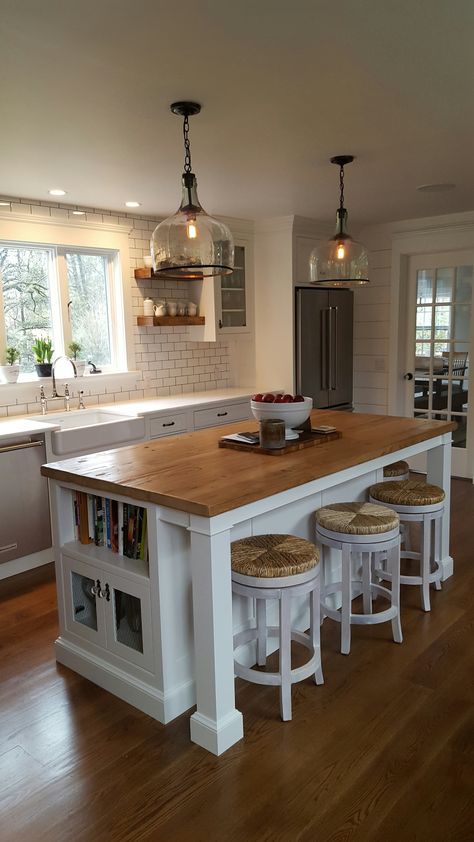 reclaimed barnwood island top, hand blown glass cloche pendant lights, white shaker cabinets with beveled glass Dapur Skandinavia, Dapur Rustic, Farmhouse Kitchen Lighting, Kabinet Dapur, Farmhouse Kitchen Island, Large Kitchen Island, Modern Kitchen Interiors, Popular Kitchens, Kitchen Island Design