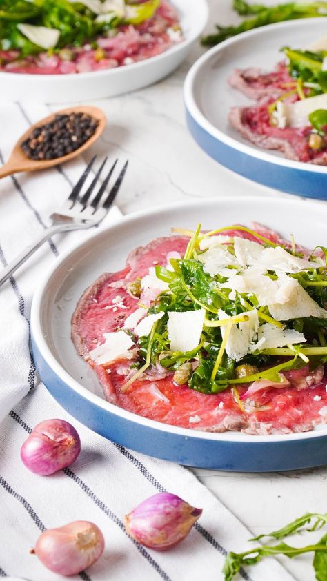 Beef carpaccio is a delicate and sophisticated appetizer. Tender slices of beef tenderloin meld with briny capers, tangy shallots, truffled arugula and savory Parmesan cheese for an impressive dish. Beef Carpaccio Recipe, Carpaccio Recipe, Italian Cooking Class, Beef Carpaccio, Baby Arugula, Food Italian, Beef Tenderloin, Food Heaven, Italian Cooking