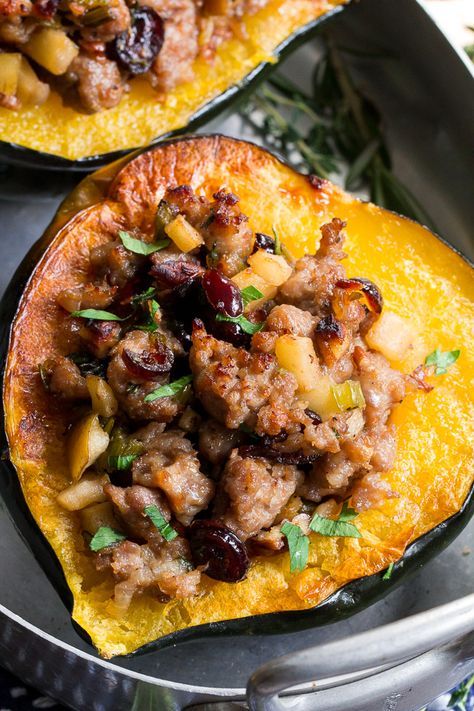 This Roasted Stuffed Acorn Squash is filled with all your favorites - sausage, apples, cranberries, onions, celery and savory herbs. The stuffing is packed with savory/sweet flavors and the perfect addition to a holiday gathering, or for any meal! Paleo, gluten free, Whole30 compliant. Paleo Acorn Squash, Sausage Stuffed Acorn Squash, Paleo Running Momma, Stuffed Acorn Squash, Acorn Squash Recipes, Meat And Vegetables, Savory Herb, Squash Recipe, Recipe 30