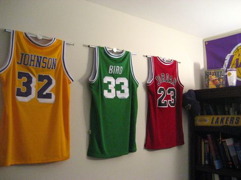 Ultra Mount jersey display hangers help create the ultimate Los Angeles Laker, Boston Celtics and Chicago Bulls Wall! Basketball Bedroom, Football Rooms, Basketball Room, Sport Bedroom, Jersey Display, Ultimate Man Cave, Man Cave Basement, Man Cave Home Bar, Sports Room