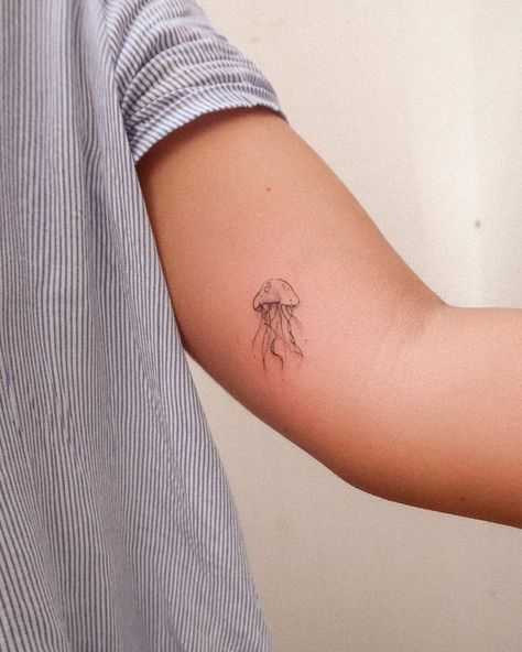 Discover the art of transformation with jellyfish tattoos in our article. Explore it and find 50+ stylish designs with meanings explained. Small Animal Tattoo Ideas, Small Animal Tattoo, Animal Tattoo Ideas, Jellyfish Tattoo, Small Tattoo, Tiny Treasures, Jellyfish, Tattoo Ideas, Tattoos