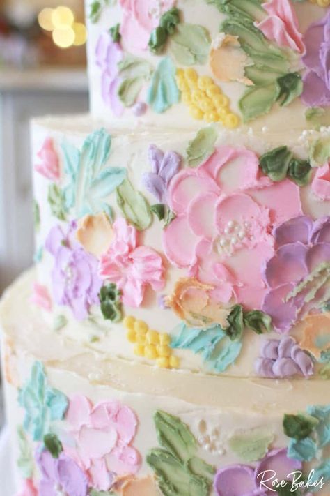 This Bridgerton-Inspired Wedding Cake is one of my all-time favorite wedding cakes. With buttercream flowers in soft pastels and tiny pearls for a touch of timeless elegance, this wedding cake is the perfect picture of the whimsy and color of a fairy tale. Pastel Floral Wedding Cake, Wedding Cake Pastel Flowers, Bridgerton Wedding Cake, Cakes With Buttercream Flowers, Wedding Cake Buttercream Flowers, Pastel Wedding Cake, Colorful Wedding Cake, Pastel Wedding Cakes, Wedding Cake Videos