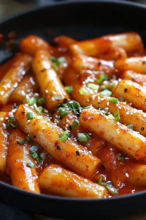 If you're looking to spice up your snacks, try this delicious recipe for Korean Tteokbokki! With its bold flavors and chewy rice cakes, they're perfect for any occasion! This dish combines the perfect balance of sweet and spicy that will leave your taste buds dancing. Whether you're hosting friends or enjoying a night in, this flavorful treat is sure to impress. You won’t believe how easy it is to make at home! Don’t wait, bring the taste of Korea to your kitchen with these yummy, spicy rice cakes that everyone will love! Korean Tteokbokki, Spicy Tteokbokki, Korean Fish Cake, Peeling Boiled Eggs, Tteokbokki Recipe, Korean Rice Cake, Grilled Lamb Chops, Korean Side Dishes, Pan Seared Scallops