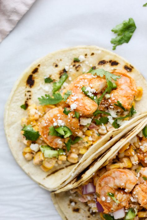 These Shrimp and Street Corn Tacos are the best and easiest Summer meal! Creamy Mexican style street corn topped with spicy juicy shrimp all tucked away in a charred corn tortilla. Yes please! #shrimptacos #streetcorn #elote #mexicanstreetcorn Mexican Street Corn Shrimp Tacos, Shrimp Corn Tacos, Healthy Summer Dinner Recipes Shrimp, Shrimp Recipes Easy Dinners, Mexican Style Street Corn, Street Corn Tacos, Corn Elote Recipe, Corn Tacos, Street Taco Recipe