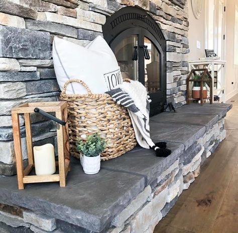 All stone, all day. Stacked stone for that natural rustic vibe. Simple wicker basket with strategically placed throw blanket peeking out. Lanterns, candles, and a touch of greenery. Faux plants, succulents. Follow PNW HOMEBODY on YouTube for weekly tutorials 🖤 Fireplace Blanket Basket, Basket On Fireplace Hearth, Fireplace Basket Decor, Wicker Basket Decor Ideas, Fireplace Basket, Fireplace Hearth Decor, Blanket Basket For Living Room, Wicker Basket Decor, Basket Decor Ideas