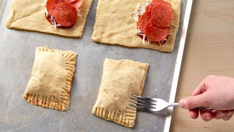 Crescent Pizza Pockets Recipe - Pillsbury.com Crescent Pizza, Crescent Dinner Rolls, Pizza Pockets Recipe, Seafood Pizza Recipes, Homemade Pizza Pockets, Pockets Recipe, Cheesy Sandwich, Superbowl Food, Crescent Roll Pizza