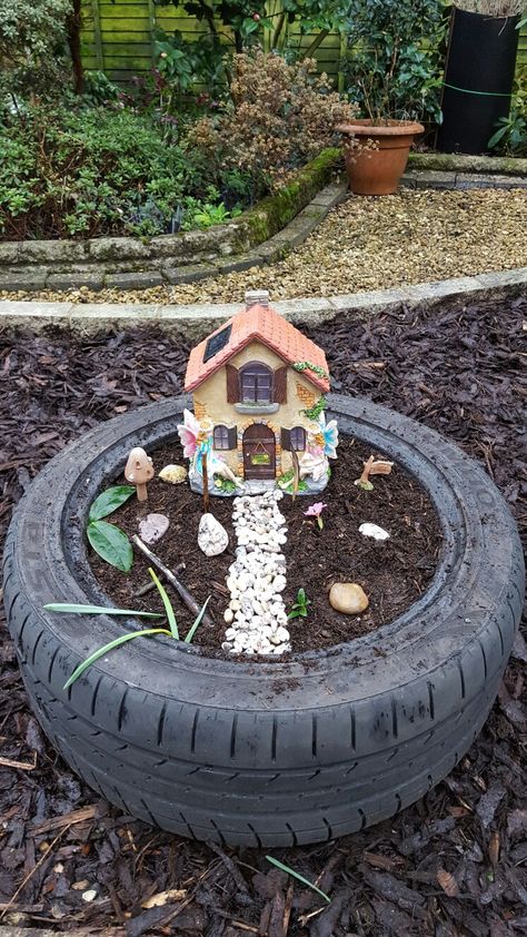 Fairy garden made from old tyre and pebbles collected from the beach Easy Fairy Garden Ideas, Easy Fairy Garden, Fairy Garden Ideas For Kids, Attract Fairies, Garden Ideas For Kids, Tire Garden, Indoor Fairy Gardens, Fairy Garden Ideas, Fairy Garden Designs