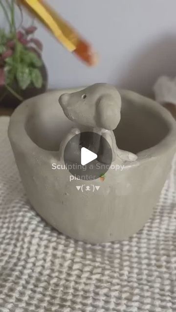 Discover a world of ceramics! on Instagram: "Snoopy ceramic planter by @with.love.jill

Check out our link in bio for similar ceramic creations, and remember to follow @craftyclayworks for more! 🤎 ✧˖°

✦•𐃬 𐃰 𐃨 𐃢 𐃭•★•𐃭 𐃢 𐃨 𐃰 𐃬•✦

#potterylove #potteryart #wheelthrownpottery #midcenturyceramics #ceramicsclass #ceramicsculpture #studiopottery #australianceramics #ceramicsart #modernceramics #potterystudio #ceramicstudio #ceramicsdaily #handpaintedceramics #stonewareceramics #ceramicsculptures #handbuiltceramics #ceramicsofinstagram #potterybarn #creativeatheart #ceramicsstudio #handmadeceramics #potterywheel #instapottery #woodfiredceramics #ceramicsdesign #handmadepottery #contemporaryceramics #instaceramics #potterylife" Snoopy Ceramic, Dog Pottery, Ceramic Creations, Wheel Thrown Pottery, Mid Century Ceramics, Stoneware Ceramics, Egg Cups, Ceramic Studio, Pottery Wheel