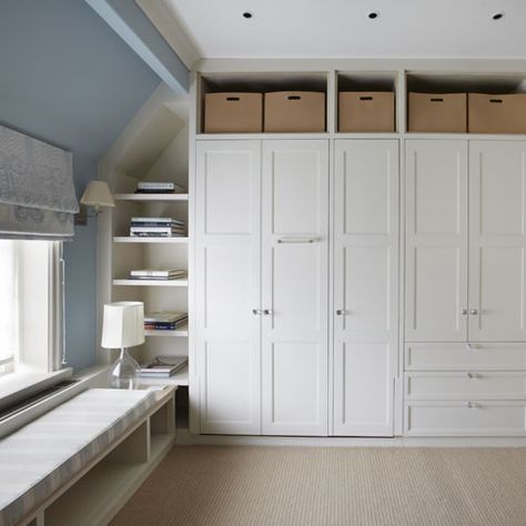 built-in wardrobe with bookshelf on side - like this idea! Top Of Wardrobe Storage Baskets, Slanted Bedroom, Ivy Bedroom, Sloping Ceiling, Californian Bungalow, Bungalow Ideas, Fitted Bedroom Furniture, California Bungalow, London Houses