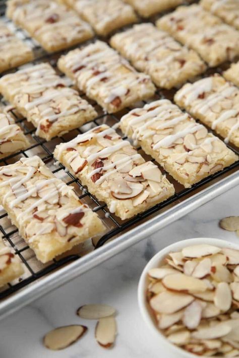 Almond Bars are a delicious cross between shortbread and sugar cookie bars, topped with sliced almonds and a sweet almond glaze. They're crisp, yet tender and perfect for holiday cookie exchanges or neighbor gifts. Almond Bars Recipe Simple, Scandinavian Almond Bars, Sliced Almond Cookies, Create Tv Recipes, Almond Bars Recipe, Almond Squares, Cookies With Almonds, Potato Crackers, Sweet Potato Crackers