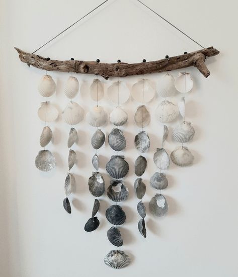 Beautiful handmade driftwood and shell winchimes/wall art. I love to hand-collected driftwood and shells from Florida Gulfcoast beaches. All shells are found and collected empty. I hand-tied each shell with durable spectra line. The driftwood has been treated with several coats of enamel to protect from weather.  The shells make a light and lovely sound in the wind.  Looks beautiful outside or inside. Will make a great gift for a loved one...or for yourself. Will look lovely at a coastal-themed shower. And at your coastal home! Each chime is one of a kind, but I may be able to recreate, depending on which shells are available. Ask any questions. Driftwood Shell Hanging, Shell Chimes, Shell Wall Hanging, Seashell Garland, Seashell Bathroom, Shell Hanging, Driftwood Wall Hanging, Outing Ideas, Seashell Art Diy