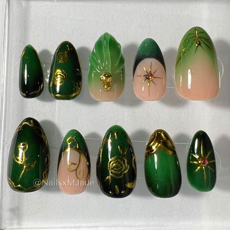 Welcome to NailsxMjade, Bestie! I'm excited to have you on board and can't wait to take this nail journey together. My brand understands the importance of self-expression and unique style through nail art, all from the comfort of your own home The Nails green, with gold earth  Nails. Perfect for any occasion. bridgerton inspired These nails are made with high-quality soft gel tips and are 100% hand-painted for a reusable, long-lasting . the images are Almond Short  Sizing How to Size Your Nails Fire Emblem Nails, Faerie Aesthetic Nails, Homecoming Nails Dark Green, Green Gold Nail Art, Green Nails Y2k, Dark Green And Gold Nails, Moss Green Nails, Goblincore Nails, Princess And The Frog Nails