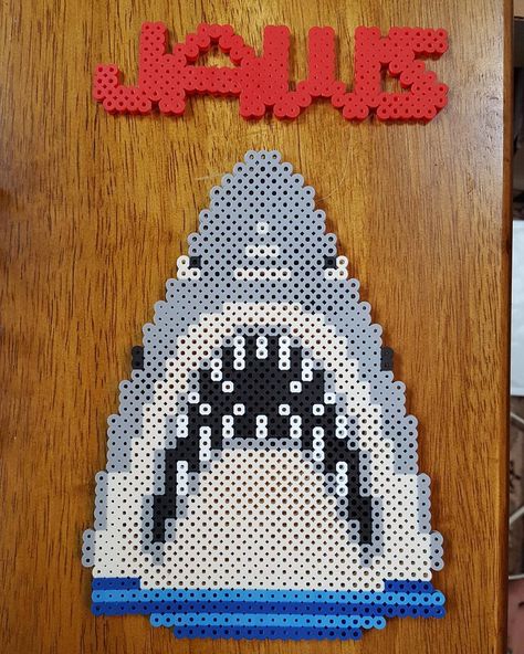 Jaws perler beads by dcs8bit Perler Halloween, Melts Beads, Diy Horror, Kandi Jewelry, Melty Bead Designs, Cross Stitch Sampler Patterns, Pixel Beads, Fuse Bead Patterns, Perler Art