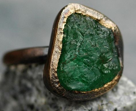 Here’s one of my gigantic raw emeralds set into my hand-fabricated oxidized 18k rose gold engagement and wedding ring set. Each of these ring sets is designed around a large, untreated raw emerald that I source specifically for the project. I have been setting uncut emeralds, diamonds, sapphires and rubies (as well as most of the semi-precious category of gemstones) into my work since 2008. Get in touch if your dream ring is centred around the raw and the rough. #rawemerald #roughemerald ... Gold Engagement And Wedding Ring, Engagement And Wedding Ring Set, Engagement And Wedding Ring, Raw Emerald, Wedding Ring Set, Rose Gold Engagement, Dream Ring, Lady And Gentlemen, Gold Engagement