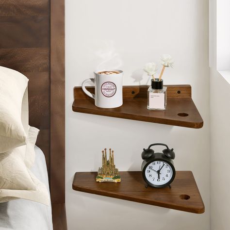 PRICES MAY VARY. Simple Design - The floating nightstand is made of beautiful walnut color, with a trapezoidal design, and the outer corners are rounded to prevent children from being hurt. You can have more space to rearrange your things, or use it as a minimalist bedside table where you can put a small lamp, phone, bottle of water, etc. Versatile Storage and Display Wall Shelf —Simple and practical, unique appearance, can be used as a floating shelf, plant shelf, desk, nightstand, side table, Floating Corner Nightstand, Bedside Table Attached To Wall, Floating Bedroom Nightstand, Bedside Wall Storage, Wall Mount Bedside Table, Wall Mount Nightstand, Bedside Floating Table, Floating Shelves By Bed, Small Space Nightstand Ideas