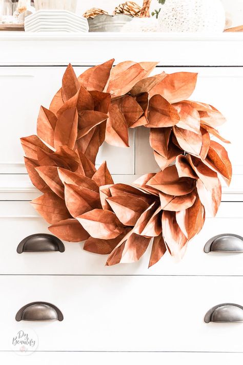 Brown paper lunch bags are crafted into a thrifty and easy DIY copper magnolia wreath that's perfect for Fall and into the holiday season! Full tutorial at DIY Beautify! #fallwreath #DIY #crafts Paper Leaf Wreath, Paper Projects Diy, Brown Paper Lunch Bags, Diy Copper, Paper Bag Crafts, Construction Paper Crafts, Paper Lunch Bags, Autumn Paper, Paper Lunch