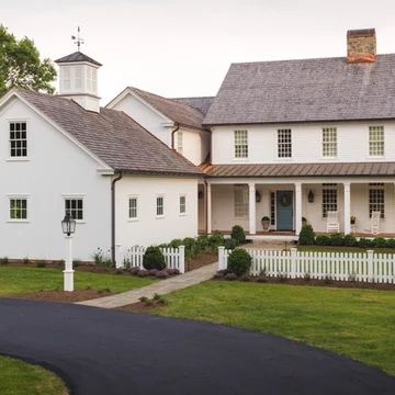 Shingle Cottage Exterior, Cedar Shake Roof White House, White House Cedar Roof, Brown Roof Ranch House, White House Brown Shingles, White House Copper Accents Exterior, Farmhouse Roof Colors, White House Brown Metal Roof, Shingle Roof With Metal Accents