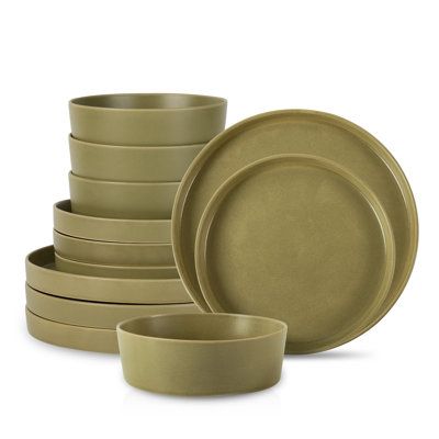 Elevate your dining experience with the Stone by Mercer MODAN stoneware dinnerware set and discover the harmony of modern design and timeless sophistication. Complete with 12 pieces, the MODAN includes 4 high-rimmed dinner plates, 4 high-rimmed salad plates, and 4 bowls. Designed to seamlessly integrate into any setting, this set is perfect for cozy intimate meals or more formal gatherings. | Stone By Mercer Project MODAN Dinnerware Set - Service for 4 green | SOEE1003 | Wayfair Canada Green Dinnerware Set, Green Dinnerware, Plates And Bowls Set, Linen Bath Towels, Stoneware Dinnerware Sets, Stoneware Dishes, Buffet Display, Kids Vanity, Stoneware Dinnerware