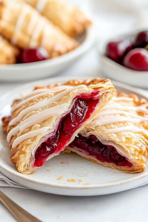 The first bite of these cherry turnovers is pure bliss. From the flaky pastry and juicy filling to the sweet glaze, they're a feast for the taste buds. Camila Hurst, Cherry Turnover, Cherry Turnovers, Easy Pastry Recipes, Sweet Cherry Pie, Turnover Recipes, Cherry Jam, Quick Treats, Cherry Filling