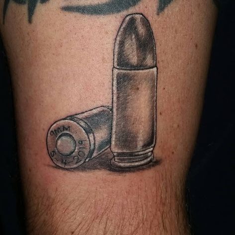 #9mm #bullet #pewpew #stillstanding #memorialdate #blackandgrey #tattoo #studio13tattoomg Bullet Drawing, Point Tattoo, Bullet Tattoo, Wind Tattoo, 9mm Bullet, Shell Tattoos, Tribute Tattoos, 44 Magnum, Scale Tattoo