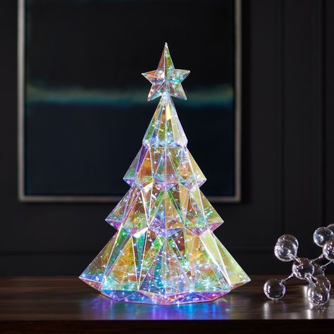 Brighten your holiday space with our Prismatic Iridescent Diamond Christmas Tree crafted by Seasonal LLC. Standing at 19 inches tall and featuring 200 LED lights, this stunning tree brings festive cheer to any indoor setting. Elevate your seasonal decor with this radiant centerpiece, meticulously designed to captivate and delight throughout the holiday season. Iridescent Christmas, Diamond Christmas, Pre Lit Christmas Tree, Tabletop Christmas Tree, Christmas Tree Crafts, Christmas Style, Ceramic Christmas Trees, Christmas Trends, Christmas Store