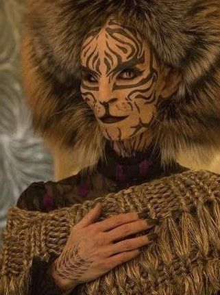 Tigris | The Hunger Games Wiki | Fandom Hunger Games Tigris, Hunger Games Hair, Hunger Games Makeup, Games Makeup, Hunger Games Capitol, Hunger Games Costume, Snow Tattoo, Quarter Quell, Hunger Games Dr