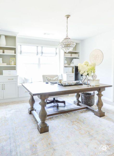 Using a dining room table as an office desk in your home office. Loving the mini chandelier, neutral decor, and shelving in my office. #office #officedecor #officedecoration #desk Desk In Dining Room, Hide Computer Cords, Home Office With Built Ins, Office Designs, Farmhouse Dining Table, Dining Room Office, Home Office Space, Office Room, Farmhouse Dining