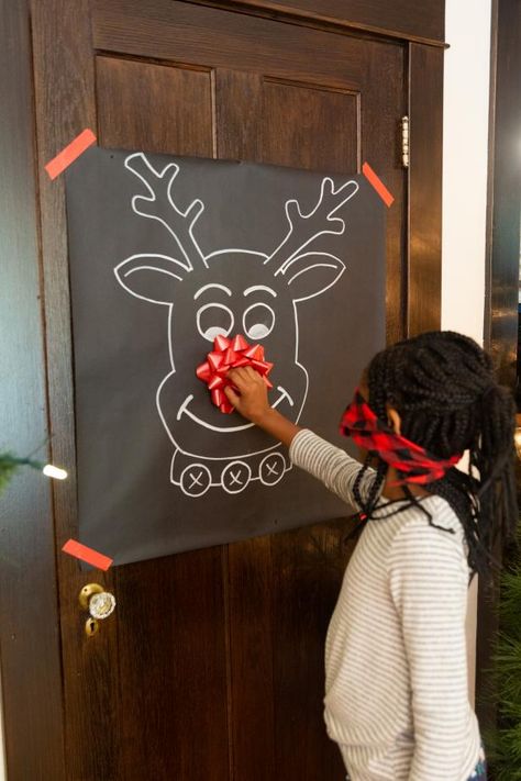 Put your art skills to the test with this Christmas twist on a classic party game. To craft your pin-the-nose-on-Rudolph game, all that's needed is a paint marker, black craft paper and a gift bow. To play, tape the reindeer face to a door and take turns wearing a blindfold while trying to pin the Christmas bow to Rudolph's nose.