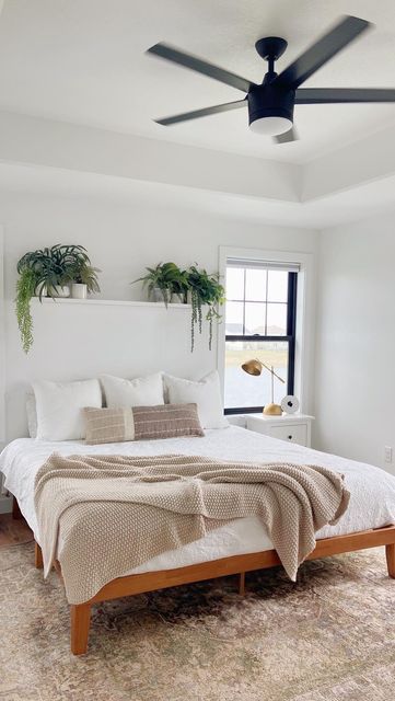 King Bed Between Two Windows Bedroom Designs, King Headboard Between Two Windows, Headboard Between Two Windows, Above King Bed Decor, King Bed Between Two Windows, Bed In Between Two Windows, Plant Shelf Above Bed, Bed Between Two Windows, Bed Between Windows