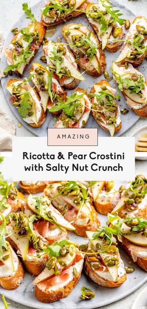 Gorgeous ricotta and pear crostini with savory prosciutto, fresh arugula and a salty pumpkin seed pistachio crunch mixture. This easy appetizer is the perfect mix of sweet, savory, creamy and crunchy and is guaranteed to impress guests! Top with honey and a sprinkle of sea salt for the ultimate flavor combo. #appetizer #christmas #holidayappetizer #crostini #snack Savory Pear Recipes, Pear Crostini, Prosciutto Appetizer, Appetizer Christmas, Ricotta Crostini, Crostini Appetizers, Fall Appetizers, Raw Pumpkin Seeds, Pear Recipes