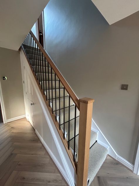 Hall makeover; Flooring from @tapicarpetsandfloors - Herringbone hard flooring and 100% wool carpet and runner along with black rods. Staircase from @nevillejohnson Oak posts, oak handrail and black metal spindles. Paint - Elephants breath from @farrowandball and eggshell brilliant white on woodwork. Accessories to be added further and internal doors to be changed to oak. All sockets and handles changed to brushed chrome. Metal Rod Staircase, Oak Stairs Black Spindles, Oak Staircase With Metal Spindles, Oak And White Staircase With Runner, Oak Stairs Black Railing, White Staircase Black Spindles, Painted Staircases With Carpet, Oak Staircase With Carpet Runner, Oak Staircase With Carpet