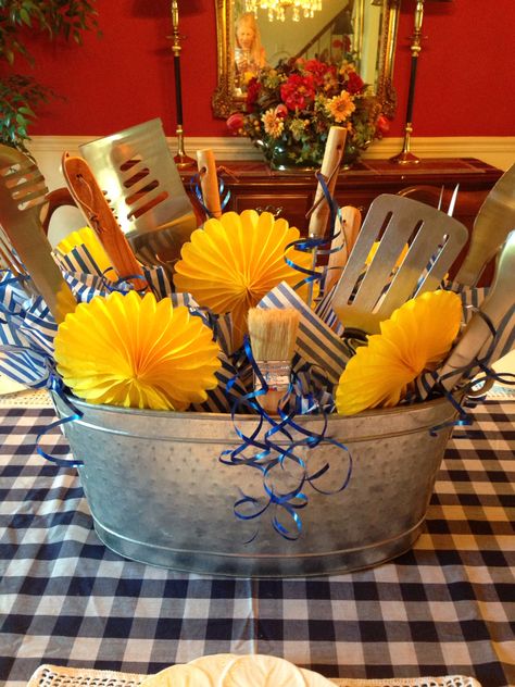 Father's Day centerpiece that I made from a collection of unused barbecue tools given to my husband over the years Fathers Day Centerpiece Ideas, Work Event Ideas, Bbq Decor, Fathers Day Lunch, Retirement Party Themes, Fathers Day Brunch, Senior Living Activities, Barbecue Tools, To My Husband