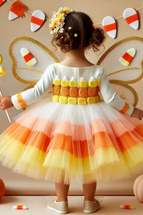 Create sweet Halloween memories with this adorable Candy Corn Fairy costume! This charming outfit features layers of candy corn-colored tulle, sparkling fairy wings, and a cute candy corn wand. Perfect for kids who love dressing up, this costume is ideal for Halloween parties, trick-or-treating, or any festive occasion. Get ready to sprinkle some magic and sweetness this Halloween! Diy Candy Corn Costume, Candy Corn Outfit, Candy Corn Costume Women, Magical Candy, Funny Group Halloween Costumes, Corn Costume, Candy Corn Costume, Halloween Memories, Fairy Halloween Costumes