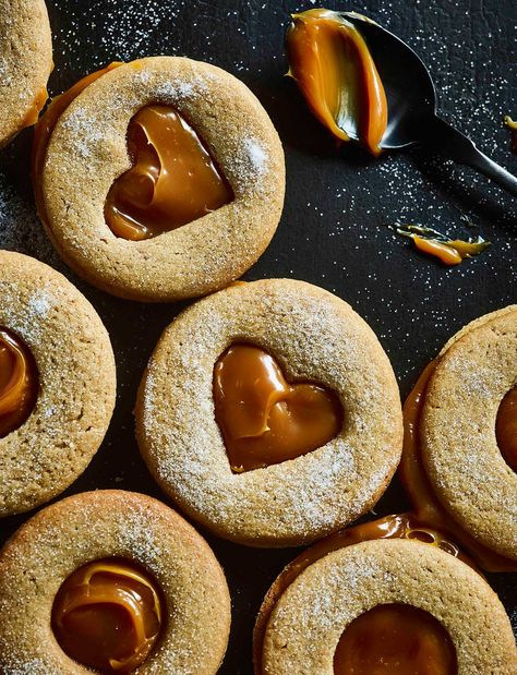 The classic Jammie Dodger gets a 2019 makeover. These salted caramel biscuits make a sweet gift for Valentine��’s Day, if you use a small heart-shaped cutter to stamp out the centres Magazine Recipe, Caramel Biscuits, Vegetarian Cookies, Food Vegetarian, Recipe Sweet, World Food, Biscuit Cookies, Cannoli, Photography Awards