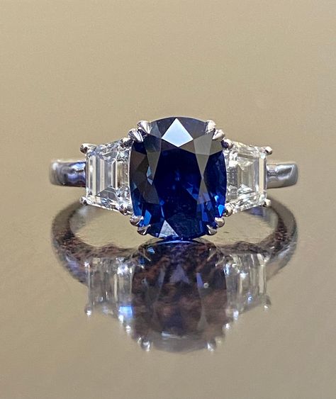 "DeKara Designs Collection Beautiful Modern/Art Deco Ceylon Blue Sapphire and Diamond Ring Metal- 90% Platinum, 10% Iridium Stones- Genuine Oval Ceylon/Sri Lanka Royal Blue Sapphire 3.75 Carats. Two Trapezoid Cut Diamonds F Color VS1 Clarity 1.09 Carats. Size-6 3/4. FREE SIZING Entirely Handmade, Classic and Timeless Art Deco Inspired Ceylon Oval Royal Blue Sapphire Diamond Engagement Ring. This ring is out of this world with the center Ceylon Sapphire being exceptional in quality, clarity, colo Art Deco Sapphire Ring With Vvs Clarity, Luxury Art Deco Sapphire Ring With Brilliant Cut, Blue Sapphire Engagement Ring Oval, Art Deco Sapphire Diamond Ring In Platinum, Art Deco Sapphire Ring With Platinum Center Stone, Art Deco Sapphire Engagement Ring, Luxury Oval Diamond-cut Sapphire Ring, Pink Sapphire Pendant, Sapphire Diamond Engagement