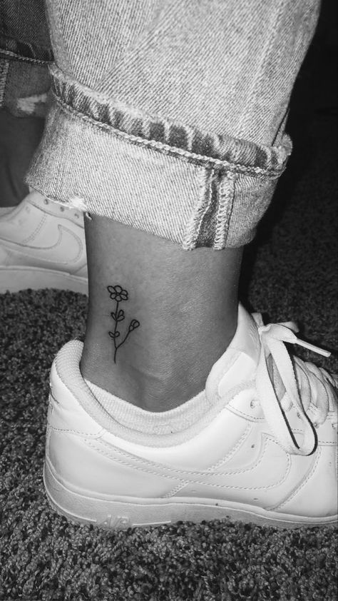 Ankle tattoo
Flower tattoo 
Small Ankle Simple Tattoos, Tattoo Ideas Female Small Ankle, Tattoo Ankle Ideas Female, Small Flower Tattoos On Ankle, Flower Tattoo On Ankle For Women, Cute Simple Ankle Tattoos, Small Daisy Tattoo Ankle, Dainty Flower Ankle Tattoo, Tattoo Ideas Small Ankle